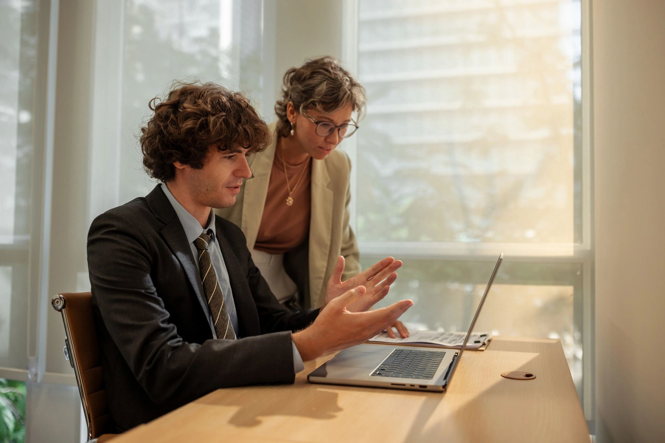 Business coaching session with laptop and discussion